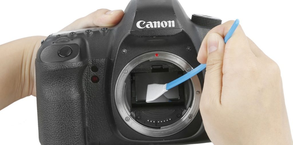 camera maintenance, keeping your sensor and lens clean, photo of camera sensor being cleaned